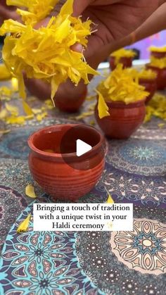 someone placing yellow flowers in small bowls on a table with an advertise that reads bring a touch of ralliton with a unique twist in your ladi ceremony