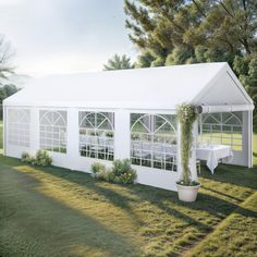 a white tent set up with tables and chairs