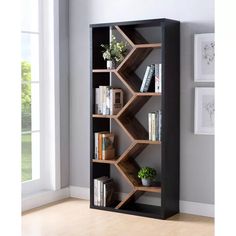 a bookshelf with several shelves in the corner