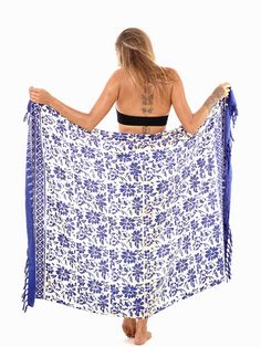 Enhance your look with this floral sarong with fringed edges. Easy to tie and many ways to wear the cover-up. Don't limit yourself. Using the ancient batik technique to print, colors may slightly vary due to process. Semi-sheer Lightweight 67x45 inches Made of soft rayon Hand soak in cold water before first wear Bohemian Batik Print Sarong For Summer, Summer Bohemian Batik Print Sarong, Bohemian Wrap Sarong For The Beach, Bohemian Printed Sarong For Festivals, Bohemian Printed Sarong For Beach, Bohemian Printed Beach Sarong, Bohemian Cotton Sarong For Summer, Bohemian White Sarong For Beach, Bohemian Wrap Sarong For Vacation