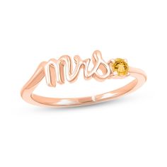 Mark a bride's change of status with this charming ring featuring "Mrs." spelled out in elegant 10K rose gold letters. A citrine perfectly punctuates the word art, adding a pop of color and making it a delightful piece to highlight the wedding colors or unique sense of style of the wife-to-be. Mrs Ring, Wife To Be, White Lab, Gold Letters, Word Art, How To Take Photos, Wedding Colors, Citrine, Apparel Accessories