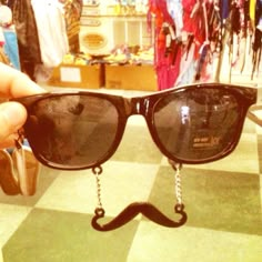 a pair of sunglasses with a fake moustache on them