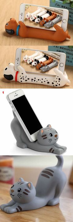 an image of a cell phone holder made out of cat figurines with cats on them