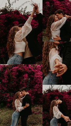 a man and woman are kissing in front of purple flowers with their arms around each other