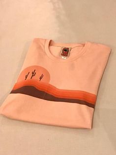 Unisex 70s Salmon Desert Horizons tee | Soft 1970s style desert peach coral pink orange and brown graphic retro tshirt | Cactus shirt Los 70s, Typography Tshirt Design, Nyc Clothes, Orange Blush, Cactus Shirt, 1970s Style, Shirt Design Inspiration, Cooler Look, 1970s Fashion