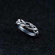 This beautifully crafted sterling silver leaf ring captures the essence of nature. Inspired by woodland forests, the rustic band is handmade from oxidized silver, highlighting the intricate leaf details that symbolize growth and harmony. Versatile and timeless, this unisex ring is perfect for both everyday wear and special occasions, making it a meaningful gift for any nature lover. Details:     Material: 925 Sterling Silver     Finish: Oxidized for a vintage, rustic look Our pieces are crafted Rustic Sterling Silver Rings For Anniversary, Nature-inspired Sterling Silver Ring With Oxidized Finish, Nature-inspired Silver Promise Ring, Rustic Sterling Silver Rings In Silver Color, Silver Nature-inspired Promise Rings, Rustic Silver Promise Ring, Rustic Sterling Silver Rings, Leaves Engagement Ring, Bark Ring