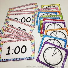 several different colored cards with numbers on them and one has an image of a clock