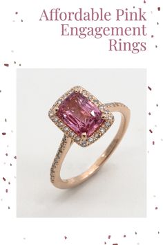 a pink engagement ring with diamonds on it