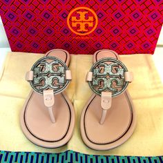 Discontinued Very Rare Bling Designer Leather Sandals With Rhinestones, Designer Round Toe Sandals With Rhinestones, Designer Rhinestone Sandals With Round Toe, Designer Sandals With Rhinestones And Round Toe, Seashell Pink, Bow Flip Flops, Logo Shoes, Tory Burch Miller Sandals, Glitter Flats