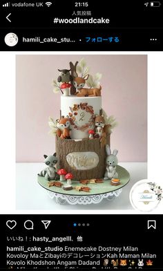 a three tiered cake with animals on it