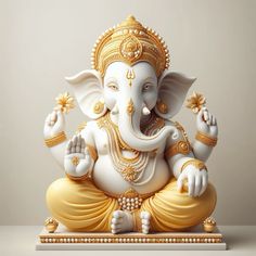 a statue of an elephant sitting on top of a white table next to a gray wall