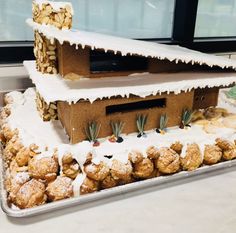 a cake made to look like a house with snow on top