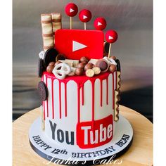 a red and white birthday cake with the words youtube on it