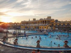 many people are swimming in a large pool