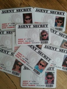 several id cards with the name agent secret on them