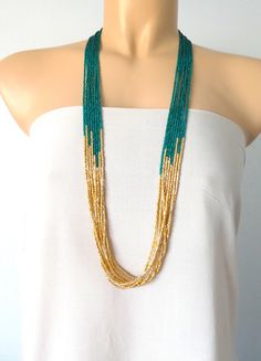 "Peacock green and light gold long boho necklace, seed bead necklace, beaded necklace, beaded multistrand necklace,green necklace,bridesmaids We can make this necklace in any colors! It has 8 strands. Matching earrings sold here https://www.etsy.com/listing/218792281/light-gold-beaded-earrings-gold Size shown in pictures is 33\". Please read specifications on SIZES below: ❤ SIZES This item comes in several sizes, kindly choose at checkout. The easiest way to find out which length suits you best Bohemian Green Beads For Wedding, Green Beaded Chain For Wedding, Green Multi-strand Beaded Jewelry, Green Multi-strand Jewelry With Tiny Beads, Green Wedding Necklaces With Colorful Beads, Green Multi-strand Necklace With Tiny Beads, Elegant Green Beaded Necklaces With Gold Beads, Elegant Green Beaded Necklace With Gold Beads, Maroon Necklace