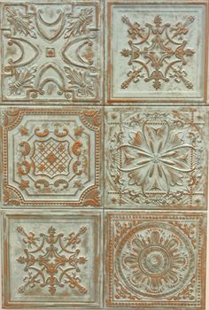 an old tin ceiling tile with different designs on it