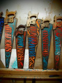 several skateboards are lined up on a shelf