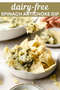 spinach artichoke dip with tortilla chips on the side and text overlay reading dairy - free spinach artichoke dip