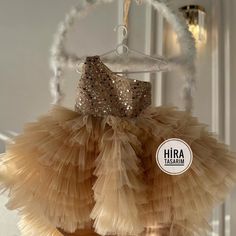 "Gold Sequin Ribbon Baby Girl Wedding Dress"  Make your little angel sparkle on her special day! ✨✨ Dress her up in this stunning Gold Sequin Baby Ribbon Girl Wedding Dress and watch her shine like a star!  ✨ Features: 🌟 Shimmering gold sequins for a glamorous look 👗 Soft and comfortable fabric for all-day wear 🎀 Delicate bow detailing for an adorable touch 💫 Fluffy tulle skirt for a princess-like feel Whether she's a flower girl or attending a wedding, this magical dress will make her the c Gold Ruffled Tutu Dress For Wedding, Gold Tulle Tutu Dress With Ruffles, Gold Princess Tutu Dress With Ruffles, Princess Gold Tutu Dress With Ruffles, Gold Ruffled Tutu Dress For Pageant, Gold Ruffled Tutu Dress For Pageants, Princess Style Gold Tutu Dress With Ruffles, Gold Sequined Princess Dress For Wedding, Party Baptism Dress With Tulle Ruffles