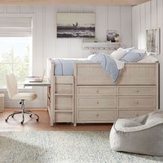 a bedroom with a bed, desk and chair