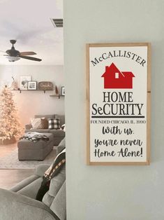 a living room filled with furniture and a sign that says home security on the wall