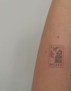 a small stamp on the back of a woman's arm that says melano