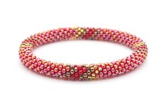 a red and gold beaded bracelet on a white background