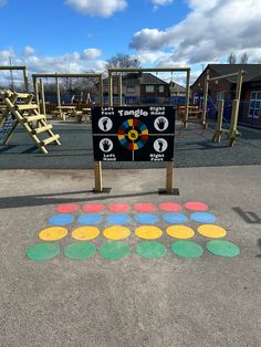 a playground with several different colored circles on the ground