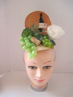 * This fascinator features a drawing of a wine bottle, grapes and wine glass and the design of the fascinator replicates the picture. * Designed on a sturdy hat form it is secured on a metal headband which will fit just about any head size. * Designed to look airy and light it would be perfect for a wine tasting event, ladies luncheon, charity event or fashion show. * Fun to wear to any Holiday Celebration, Kentucky Derby, Tea or Garden Party, Derby Events, Wine Festival, Grape Festival, Charity Fun Party Fascinator On Headband, Hat Party Ideas Ladies, Wine Costumes Ideas, Novelty Costume Hats And Headpieces For Cosplay Events, Diy Derby Fascinator, Kentucky Derby Hats Diy Funny, Grape Headpiece, Wine Hat, Diy Kentucky Derby Hat