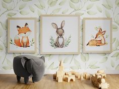 an elephant, fox and deer are on the wall in this children's room