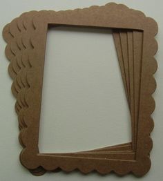 four pieces of cardboard cut out to look like frames