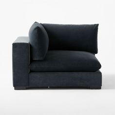 a black couch with pillows on it