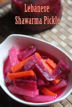 a white bowl filled with sliced up beets