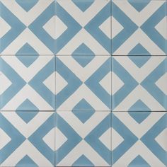 a blue and white tiled wall with diamond shapes