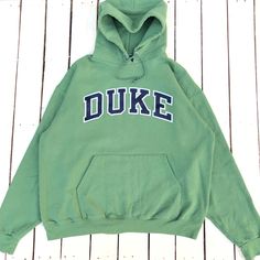 Vintage Duke University Hoodie Duke Crewneck Duke Reverse Weave Sweater Pullover Duke University Blue Devils Embroidery Logo Green XL Label : CHAMPION Label Size : XL  (refer the measurement) Made in HONDURAS Materials from 50% Cotton 50% Polyester Used Item With Condition 7.5/10 Refer Picture. Stain and No Holes. Lay Down Flat Measurement : - Width (armpit to armpit) and: 25Inches - Length (shoulder to end of garment): 27 Inches We are selling used clothing with good condition. DO NOT EXPECT the item is like new condition. Shipping: DHL EXPRESS with TRACKING NUMBER. Track and Trace http://www.dhl.com Parcel will be arrive within 3-6 business days or more due to location and custom clearing. Please PROVIDE your PHONE/CONTACT NUMBER for SHIPPING/DELIVERY purpose. VERY IMPORTANT ‼ for safer Varsity Green Hoodie For Fall, Green Varsity Hoodie For Fall, Green Long Sleeve Hoodie For College, Green Hooded Top For College, Green Varsity Hooded Sweatshirt, Green Varsity Hoodie For College, Green Hooded Sweatshirt For College, College Hoodie With Letter Embroidery And Long Sleeves, College Hoodie With Letter Embroidery