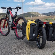 two bikes parked next to each other on the road