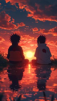 two people sitting in the water at sunset