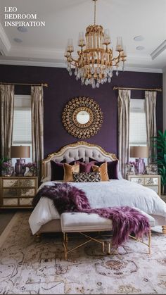 a bedroom decorated in purple and gold with a chandelier hanging above the bed