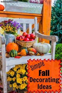 a wooden bench filled with lots of fall decorations