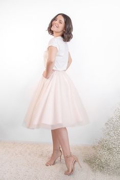 Feminine and chic, this skirt is perfect for those who love a touch of fun in their wardrobe. The soft, flowing layers of tulle fabric and flattering silhouette create a look that's both effortless and sophisticated, while the delicate details and soft colors add a romantic touch. Whether you dress it up for a special occasion or wear it with a cozy sweater for a casual day out, this skirt is sure to become a dreamy favorite. Tulle Midi Skirt, Sharp Dressed Man, French Seam, Tulle Fabric, Delicate Details, Cozy Sweater, A Romantic, Cozy Sweaters, Girly Girl