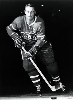 an old black and white photo of a hockey player