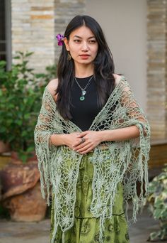 Embrace the magic of nature with the Floral Web Wrap Shawl; a hand-crocheted masterpiece adorned with intricate floral patterns and whimsical fringe, in a gorgeous seafoam green. This generously sized triangle shawl offers the perfect blend of style and comfort, effortlessly elevating your look, whether you're dancing under festival lights or savoring a cool evening outdoors. Crafted from soft, lightweight yarn, it drapes beautifully over your shoulders, providing cozy warmth without sacrificing Spring Bohemian Crochet Shawl, Bohemian Crochet Lace Shawl For Spring, Handmade Bohemian Shawl For Spring, Spring Festival Crochet Shawl, Bohemian Shawl With Crochet Lace, Crochet Shawl For Spring Festival, Green Shawl For Beach In Spring, Green Shawl For Spring Beach Outings, Green Shawl For Beach