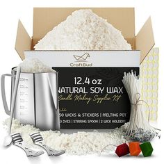 a box filled with white rice next to utensils