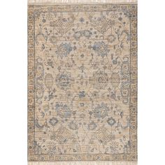 a beige and blue rug with an intricate design