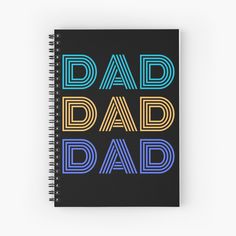 a spiral notebook with the words dad and dad written in multicolors on it