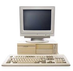 an old computer with keyboard and mouse on it's stand, in front of a white background