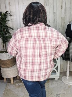 Looking for that perfect plaid button-down to channel your inner 90s vibe? Meet our Sophie Plaid Button-Down! This relaxed fit, super lightweight top features a scoop bottom detail for a feminine touch and a fringed bottom for added flair. The beautiful pink, plum, and cream plaid is just the right blend of classic and cute. With chest pockets and a boyfriend shape, Sophie is your go-to for layering over jeans and a tee or tying around your waist for that effortless, casual look. Try it over a s