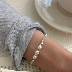 Color: Silver Fashion Element: Pearl Style: Affordable luxury style Elegant White Alloy Bracelets, White Alloy Bracelets For Party, White Alloy Bangle Bracelet, Elegant White Metal Bracelet, Trendy White Alloy Bracelets, Trendy White Alloy Bracelet, Elegant Alloy Beaded Bracelet, White Metal Pearl Bangle Bracelet, Adjustable Trendy Pearl White Jewelry