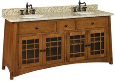 a double sink vanity with marble top and two faucets on each side,